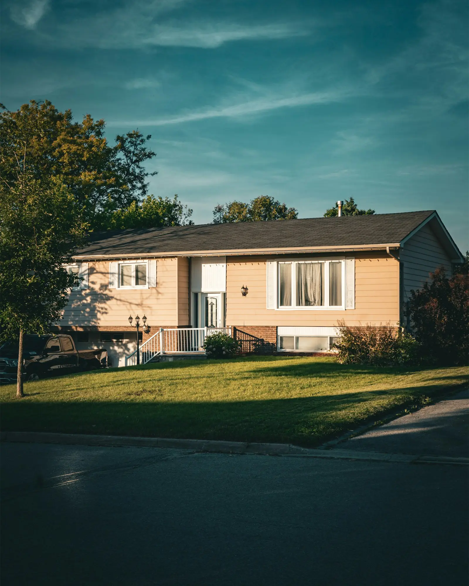 Ranch home in golden evening light after a roof replacement
